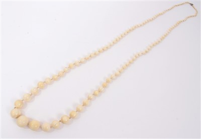 Lot 738 - Antique ivory bead necklace with a string of 119 graduated ivory beads ranging from 3.75mm - 23mm. Length 137cm.