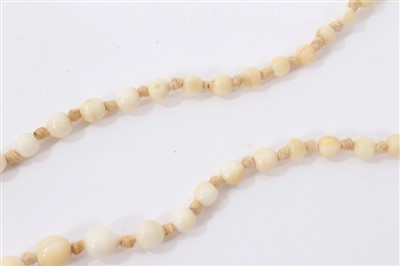 Lot 738 - Antique ivory bead necklace with a string of 119 graduated ivory beads ranging from 3.75mm - 23mm. Length 137cm.