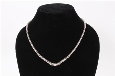 Lot 613 - Diamond Rivière necklace with a line of 119 graduated brilliant cut diamonds estimated to weigh approximately 7.00 carats in total, in white gold setting with box snap clasp. Length approximately 4...