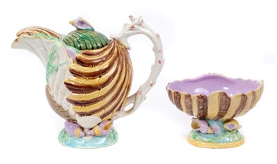 Lot 274 - Victorian majolica novelty teapot and cover, with ornate embossed shell and seaweed decoration, coral-form handle, diamond registration mark to base dating to 1870, and a similar shell-form sugar b...