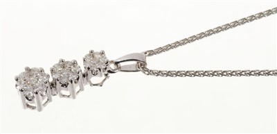 Lot 666 - Diamond pendant with a triple flowerhead cluster of brilliant cut diamonds estimated to weigh approximately 0.50 carats, in 18ct white gold claw setting on 18ct white gold chain.