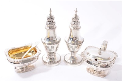 Lot 501 - Contemporary silver four piece condiment set.