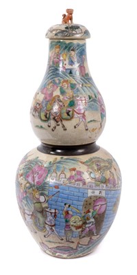 Lot 303 - Large late 19th century Chinese crackle glaze vase and cover, of double gourd form, painted in famille rose enamels with warriors, with central brown ribbon, brown etched mark to base, total height...