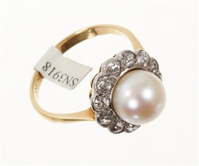 Lot 642 - Cultured pearl and diamond flower head cluster ring with a central 8.7mm diameter cultured pearl surrounded by twelve old mine-cut diamonds, on plain gold shank. Finger size P.