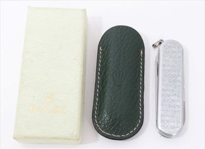 Lot 3281 - Rolex stainless steel penknife with Rolex logo design, in green leather pouch and outer box