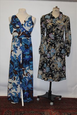 Lot 3103 - 1950's and 70's dresses including blue lace strapless dress, printed hostess dress with bat wing sleeves,  printed corduroy dress by Sherry, Jean Allen abstract print jump suit and a purple wool ka...