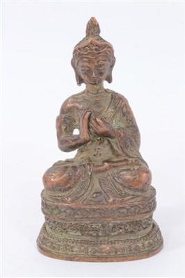 Lot 1240 - Antique Tibetan bronze figure of a seated Buddha, on stepped plinth, 10cm high