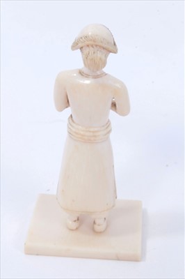 Lot 634 - Rare pair of Indo-Portuguese carved ivory figures, probably 18th century, on square plinths, 8cm high