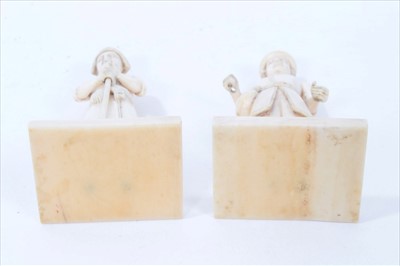 Lot 634 - Rare pair of Indo-Portuguese carved ivory figures, probably 18th century, on square plinths, 8cm high