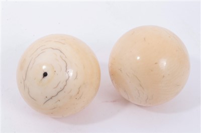 Lot 1256 - Two ivory billiard balls