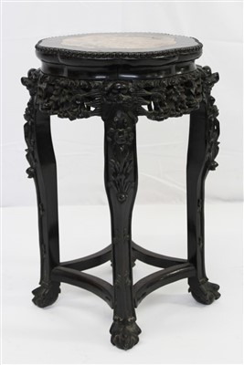 Lot 1636 - Late 19th/early 20th century Chinese carved hardwood and marble inset urn stand, with octagonal shaoed marble inset top on carved and pierced frieze and a shaped square supports, 36cm wide x 50c...