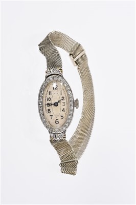 Lot 821 - Edwardian lady’s diamond-set cocktail watch, the oval dial with Arabic numerals with diamond set bezel, Swiss Oria movement in platinum case on white gold mesh bracelet