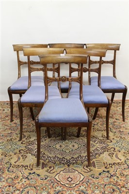 Lot 1690 - Set of six late Regency rosewood dining chairs, each with rosette carved bar back and slip-in seat on sabre legs