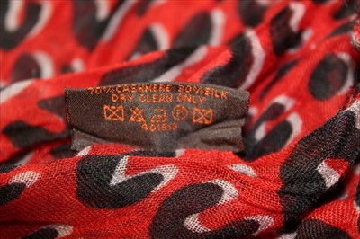 Lot 3122 - Louis Vuitton Red and Black 'Leopard' cashmere and silk scarf designed by Stephen Spouse in  box