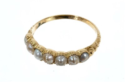 Lot 768 - Georgian gold and pearl half hoop ring with seven half pearls in gold collet setting with foliate shoulders , size O