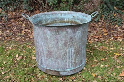 Lot 1749 - Copper vessel, cylindrical with everted rim , twin handles, 53cm diameter, together with squat copper vessel. (2)