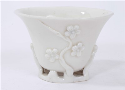 Lot 385 - 17th century Chinese blanc de chine libation cup with prunus decoration