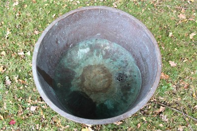 Lot 1753 - Near pair of copper vessels, straight sided with everted rim, each 64cm diameter