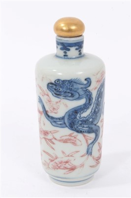 Lot 387 - Chinese snuff bottle with blue and red dragon decoration and four character mark with gilded stopper 8.5cm