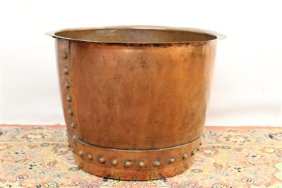 Lot 1756 - Antique copper vessel, riveted form with everted rim, 45cm diameter