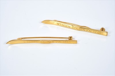 Lot 498 - Pair of 9ct gold ski brooches