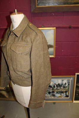 Lot 578 - Second World War British Army Battle Dress blouse with Royal Engineers badges, together with another Battle Dress blouse dated 1940 and other Second World War uniform including a balaclava