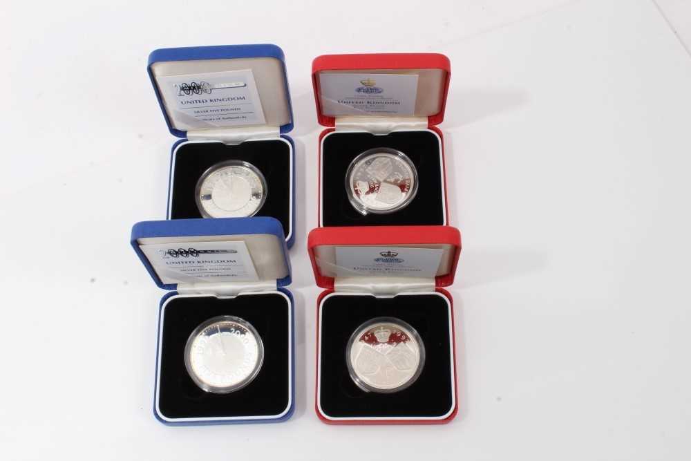 Lot 45 - G.B. The Royal Mint mixed silver proof £5 coins to include 1997 'Golden Wedding Anniversary' x 2 and 2000 'Millennium' x 2 (N.B. all cased and with Certificates of Authenticity) (4 coins)