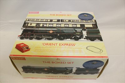 Lot 2908 - Railway Hornby 00 gauge The Boxed Set Orient Express R1038, The Flying Scotsman R869, Harry Potter Hogwarts Express all boxed (boxes have water damage)