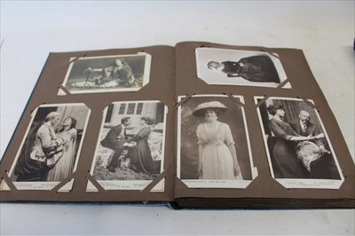 Lot 2602 - Postcards in four albums including WW1 Military Silk cards, Song cards, comic, topography, etc.