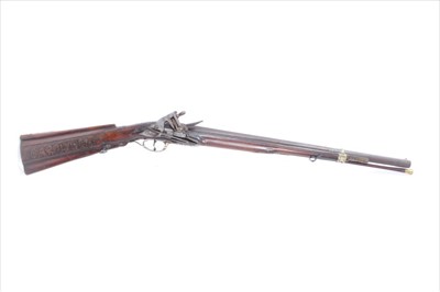 Lot 801 - Rare Late 17th century Spanish micquelet lock carbine with two stage barrel with makers stamps ,engraved lock , carved walnut stock with ' Carolvs R ' th side of stock , brass furniture with swivel...