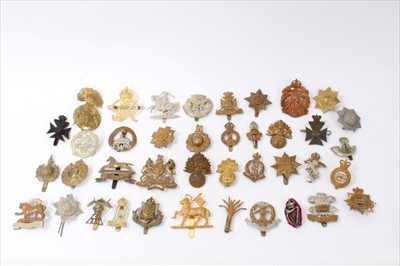 Lot 528 - Group of forty British military cap badges to include Duke of Cornwalls Light Infantry, Wiltshire Regiment and Royal Engineers