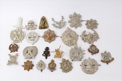 Lot 529 - Group of fourteen Scottish Regimental cap badges, to include Cameron Highlanders and Lowland Regiment, together with ten other cap badges (24)