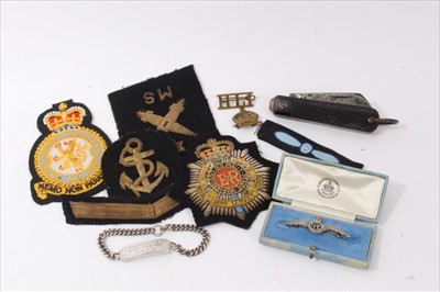 Lot 544 - Second World War Silver and Marcasite RAF Sweetheart brooch in Carrington & Co Box, together with a silver Royal Navy Dogtag, other military badges and a clasp knife