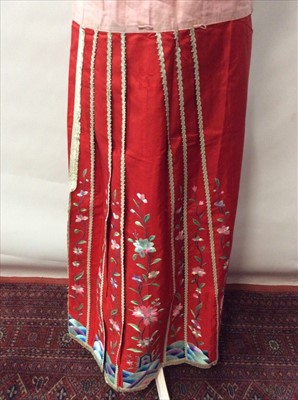 Lot 1667 - Chinese embroidered red silk Wedding skirt constructed in two pieces, two further embroidered panels and a hat