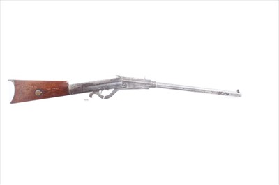 Lot 808 - Scarce Quackenbush, Herkimer, New York 1887 patent air rifle with nickel plated frame and walnut stock with pellet cavity with flap cover.