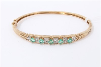 Lot 3282 - Gold 9ct emerald and diamond set bangle