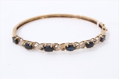 Lot 3283 - Gold 9ct sapphire and diamond set bangle