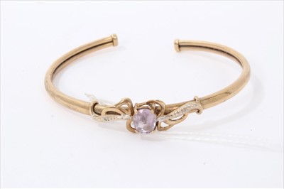 Lot 3284 - Gold 9ct amethyst torque bangle