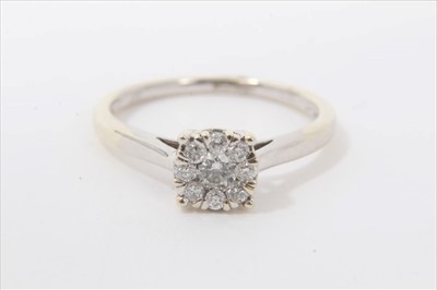 Lot 59 - 9ct white gold diamond flower head cluster ring