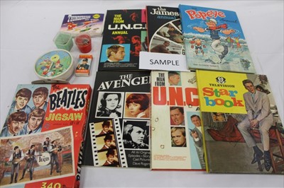 Lot 2756 - Selection of 1960s toys & games including Beatles jigsaw puzzles, Thunderbirds by Waddingtons, Smiths Noddy Clock, Noddy tins, TV related annuals, Batman & Robin mug and cereal bowl etc (qty)