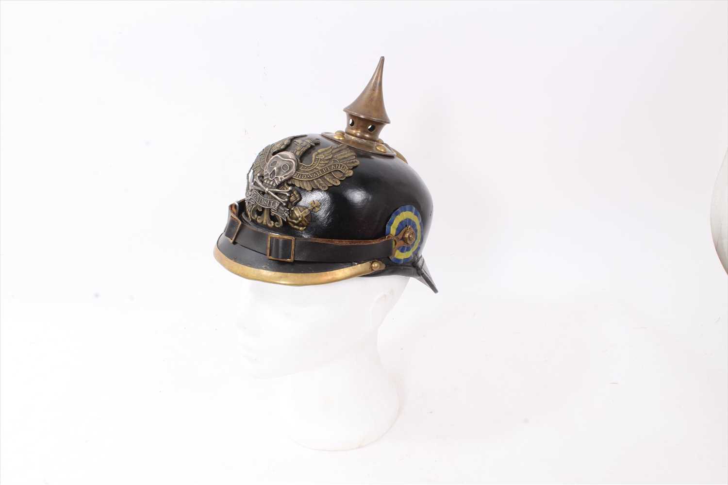 Lot 592 - Reproduction Imperial German Picklehaube helmet of leather construction with brass fittings