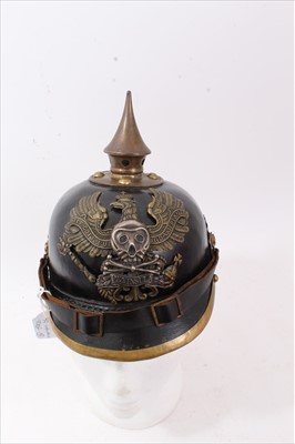 Lot 592 - Reproduction Imperial German Picklehaube helmet of leather construction with brass fittings