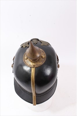 Lot 592 - Reproduction Imperial German Picklehaube helmet of leather construction with brass fittings