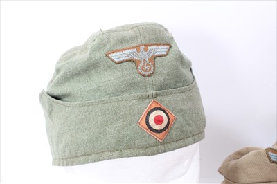 Lot 593 - Group of replica uniform to include Afrika Korps Ski Cap, SS Armband and a Afrika Korps field service cap