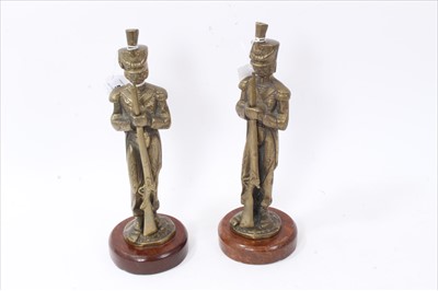 Lot 597 - Pair of brass military figures of Riflemen, mounted on wooden plinth bases, each approx. 31.5cm in height