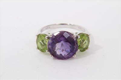 Lot 3307 - White gold (14k) amethyst and peridot three stone dress ring