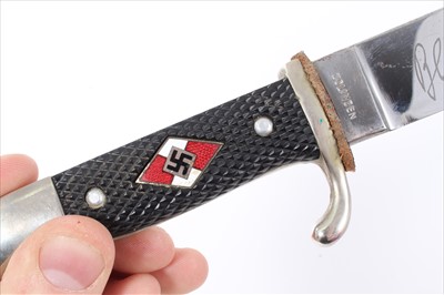 Lot 730 - Good quality early post war copy of a Hitler Youth Knife, with checkered plastic grip, inset with enamelled badge and polished steel blade marked Solingen, and engraved 'Blut und Ehre!'