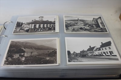 Lot 2638 - Postcards in album including real photographic street scenes, Hammersmith Bridge , topography, comic, lighthouse etc.