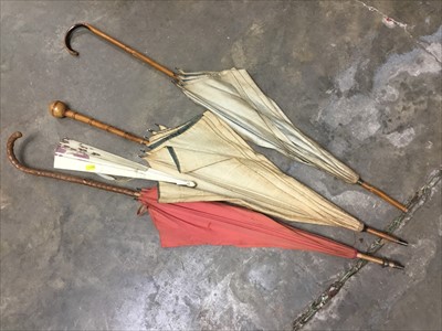 Lot 166 - Group of three antique parasols together with an antique fan