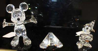 Lot 2119 - Swarovski crystal figures - Mickey Mouse,  Sorcerer Mickey Mouse and a plaque (3) all boxed